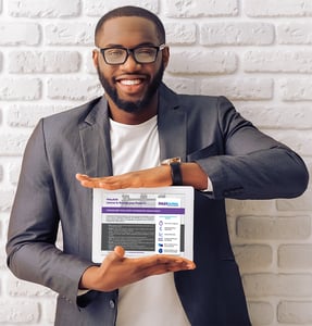 Man Holding Tablet with Data Sheet LR