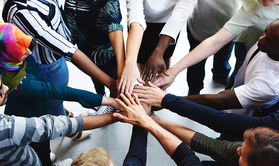 diversity-teamwork-with-joined-hands-Resize